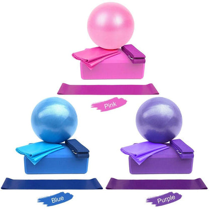 Set of exercise balls and bands in pink, blue, and purple on a white background