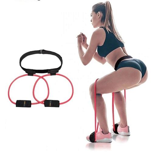 Woman exercising with resistance bands on a white background