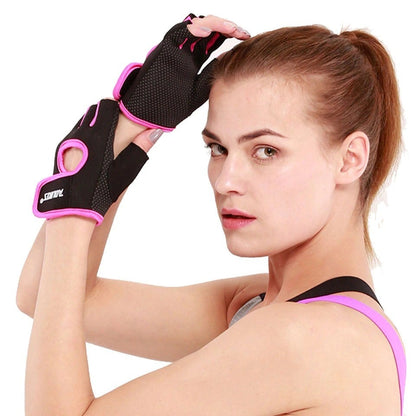 Woman wearing black and pink workout gloves on a white background