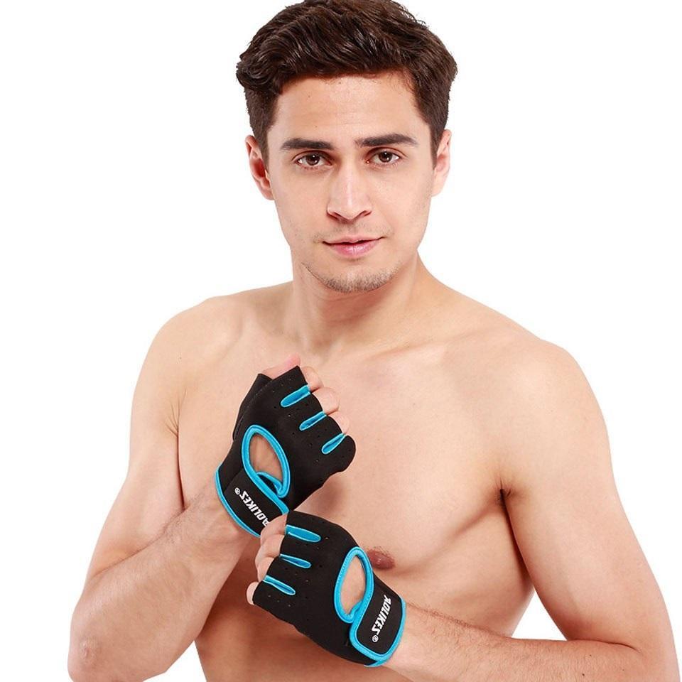 Man wearing black and blue weightlifting gloves on a white background