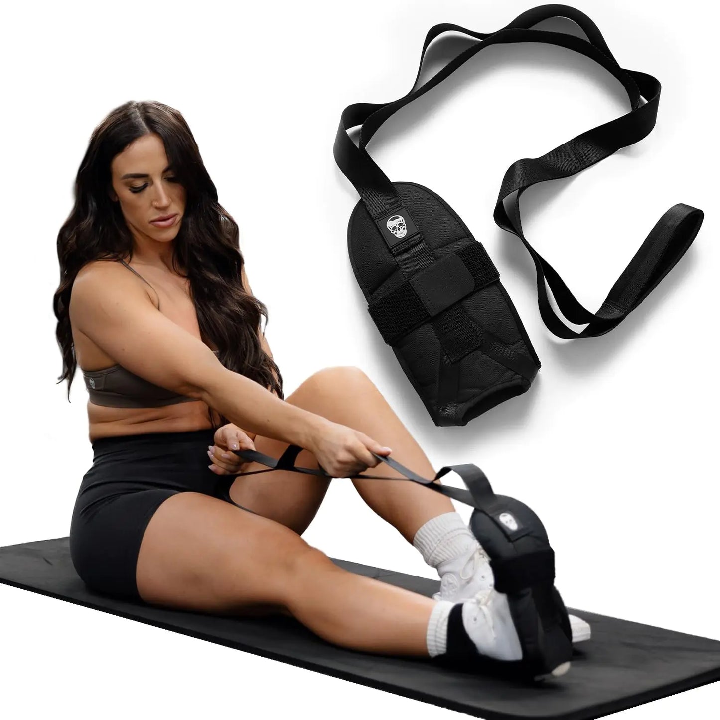 Woman using resistance bands on a mat with a black resistance band bag on a white background