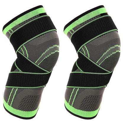 Pair of black and green knee sleeves on a white background