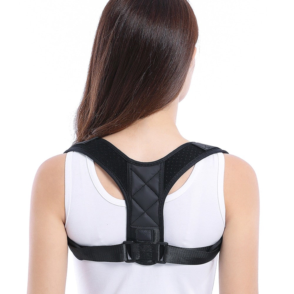 Person wearing a black posture corrector on a white background