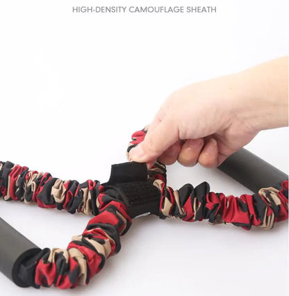 High-density camouflage sheath being attached to a knife with a hand holding it.