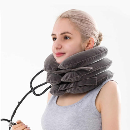Woman wearing a gray inflatable neck pillow on a white background