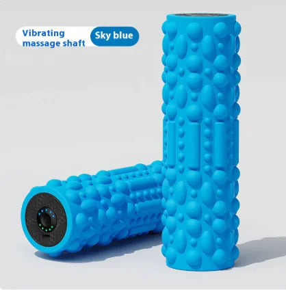 Blue foam roller with textured surface on a light gray background