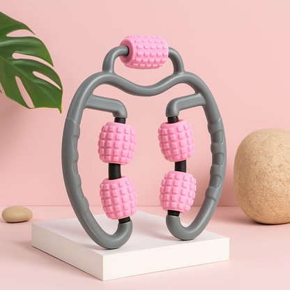 Pink and gray handheld massager on a pink background with decorative elements.