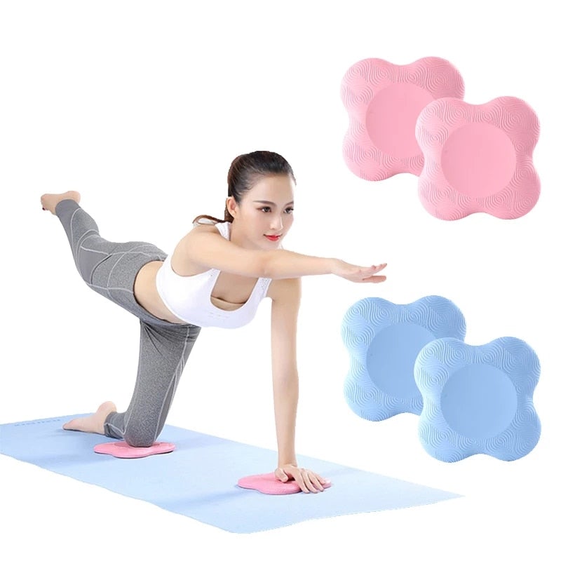 Woman practicing yoga with pink and blue foam rollers on a white background