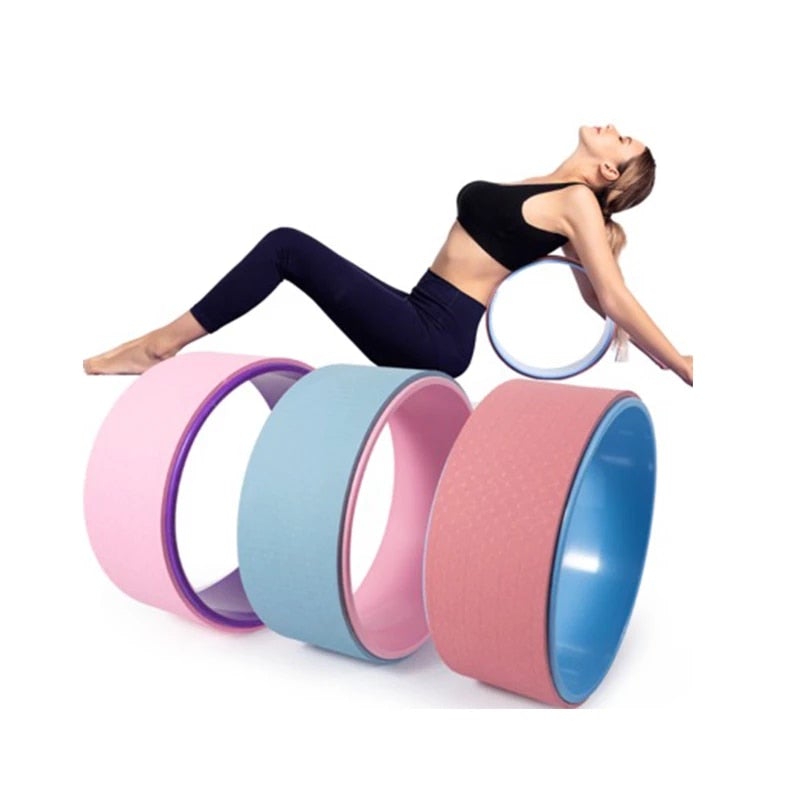 Woman using a yoga wheel with colorful options on a white background