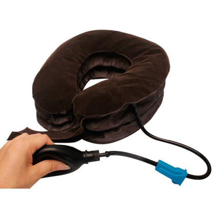 Inflatable neck pillow with hand holding pump on a white background