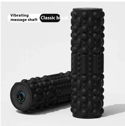 Black foam roller with vibrating massage shaft on a white background