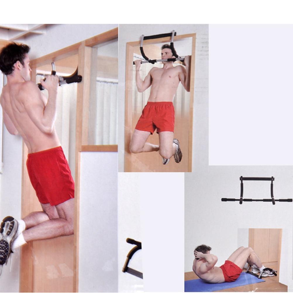 Man using a pull-up bar in a home gym setting