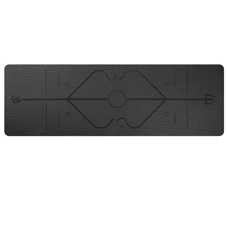 Black yoga mat with geometric design on a white background